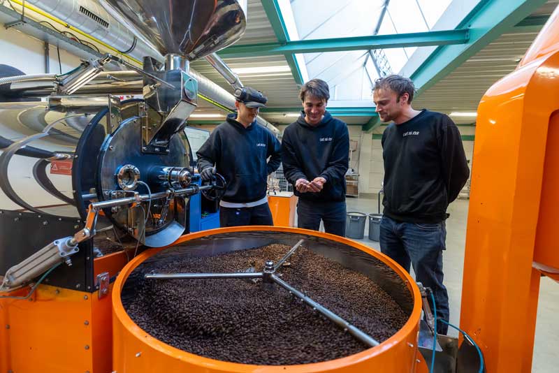 The brothers behind Café du Jour at the roaster in their own roastery
